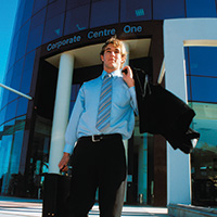 Business man exiting office building