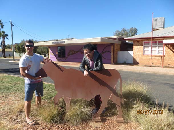 Jerry and friend with a cow statue in Quilpie