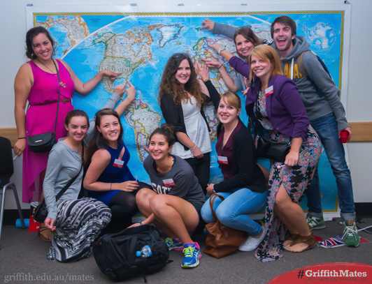 Griffith students with world map