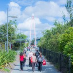 Agents walking across Gold Coast campus bridge