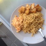 Fried potato, stir fry noodles, savoury egg and cheese sauce
