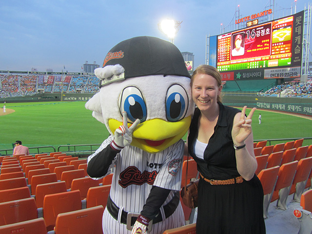 Angela with Lotte Giants Baseball mascot in Korea