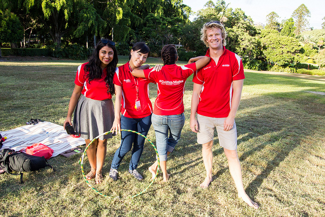 Four students volunteers (Griffith Mates) stand as a group of friends in the Brisbane Botanic Gardens.