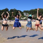 Japanese students jumping on the Noosa beach.