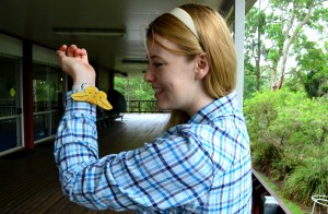 Student with big yellow moth on sleeve.