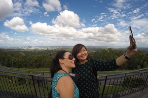 GELI student and staff pose in front of view from Mt Coot-that lookout.