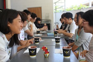Students are sitting in a cafe at Mt Gravatt chatting over coffees.