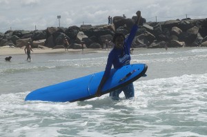 Tharshika is triumphant - she successfully surfed!