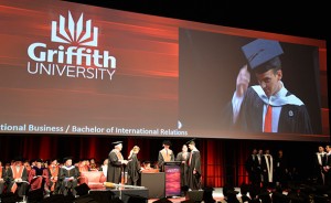 Jon doffs his motarboard at the Chancellor