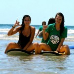 Two students on surf boards