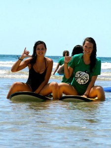 Two students on surf boards
