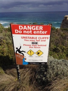 Image of warning sign at a cliff that reads, Danger Do no enter with image of stick person sliding down cliff face. 