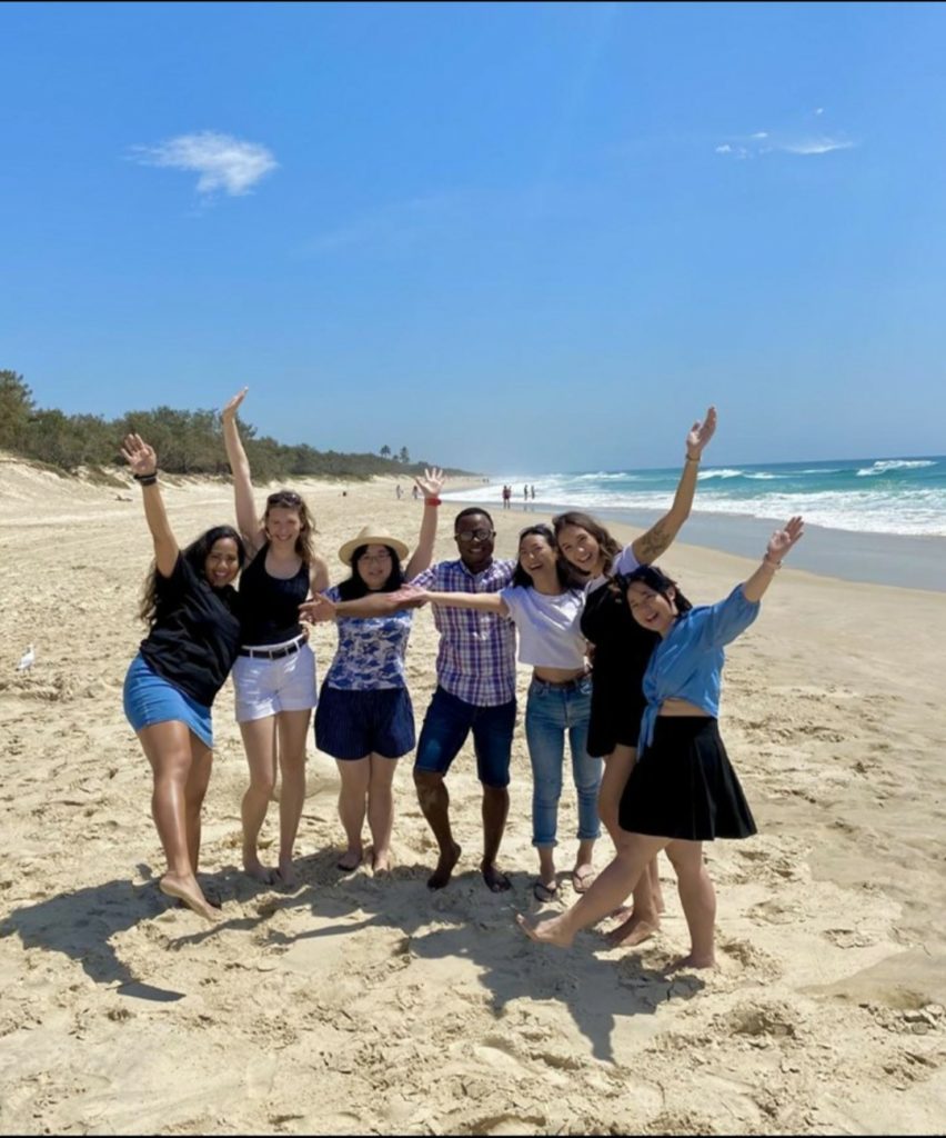 seven friends on a beach