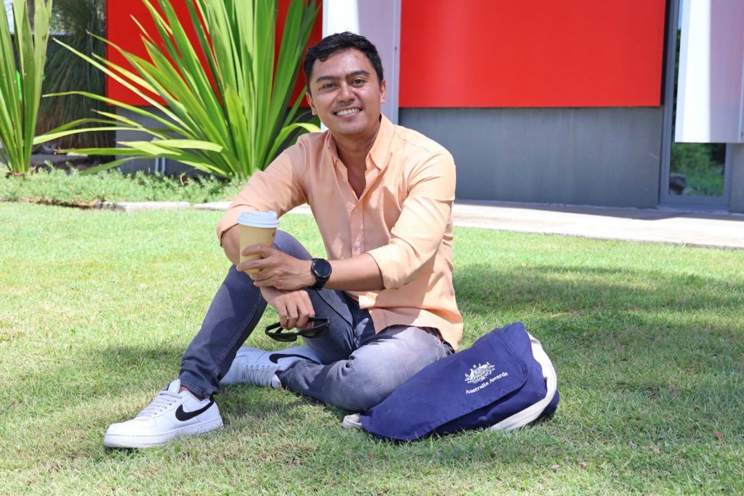 Rahman sitting on the grass