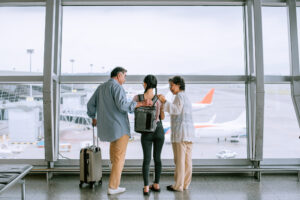 Parents saying goodbye to daughter at the airport.